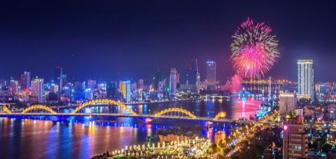 Fireworks over the Han River and the illuminated Dragon Bridge in Da Nang