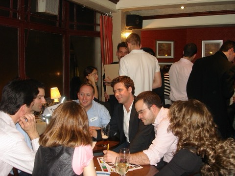 Teams sitting at tables during a pub quiz