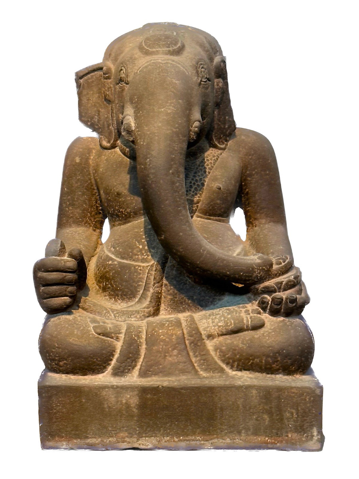 A seated sandstone Ganesha, the elephant-headed Hindu deity, carved in the Cham style, against a white background