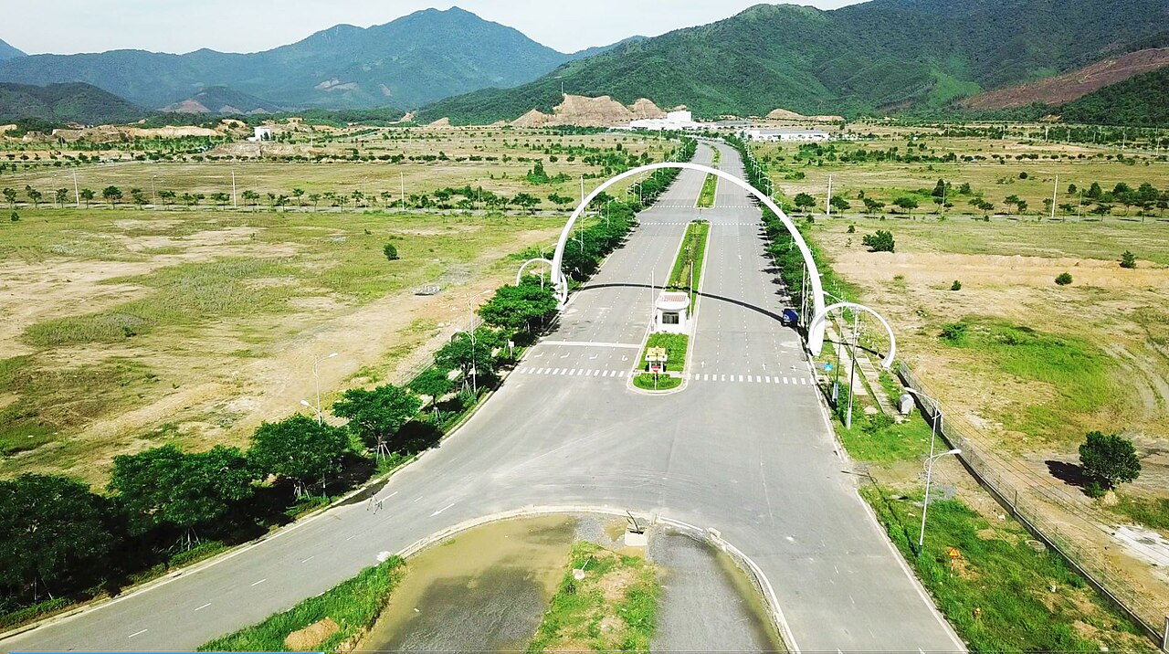 Wide view of the Da Nang Hi-Tech Park from above, with roads, open land and buildings spread across a flat site